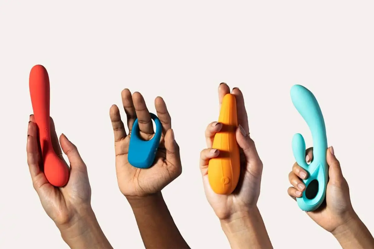 Hands holding sex toys